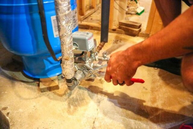 Plumber Repairing Water Line
