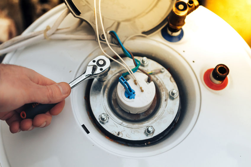 plumber repairing water heater